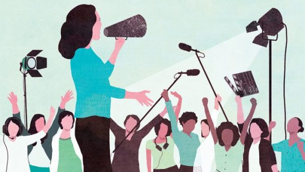 Women with megaphone and audience