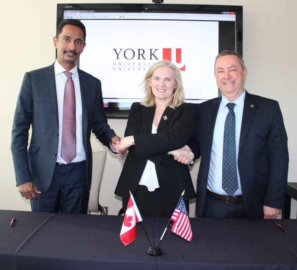 From left, Dean of York U's Faculty of Science Ray Jayawardhana, President and Vice-Chancellor of York U Rhonda Lenton and Nigel Lockyer, Director of Fermilab