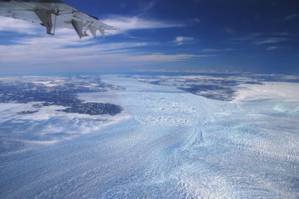 Oblique aerial photo looking west from the Greenland ice sheet interior towards Jakobshavn Isbrae, one of Greenland's largest outlet glaciers. Photo by William Colgan