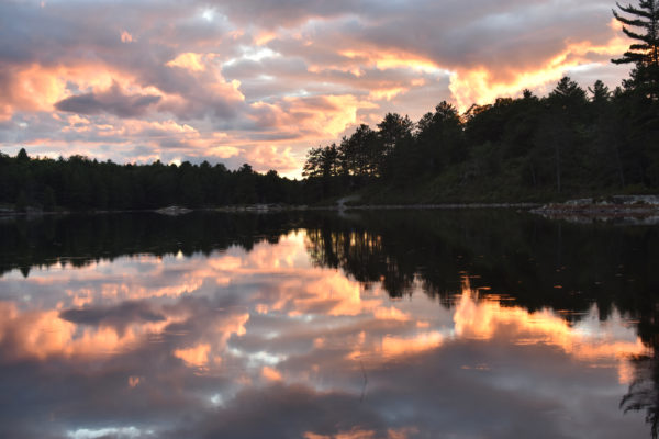 A sunset caught over Boundary Lake in Killarney Provincial Park. Photo by Amanda Liczner