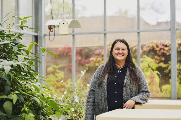 Sandra Rehan standing in a greenhouse